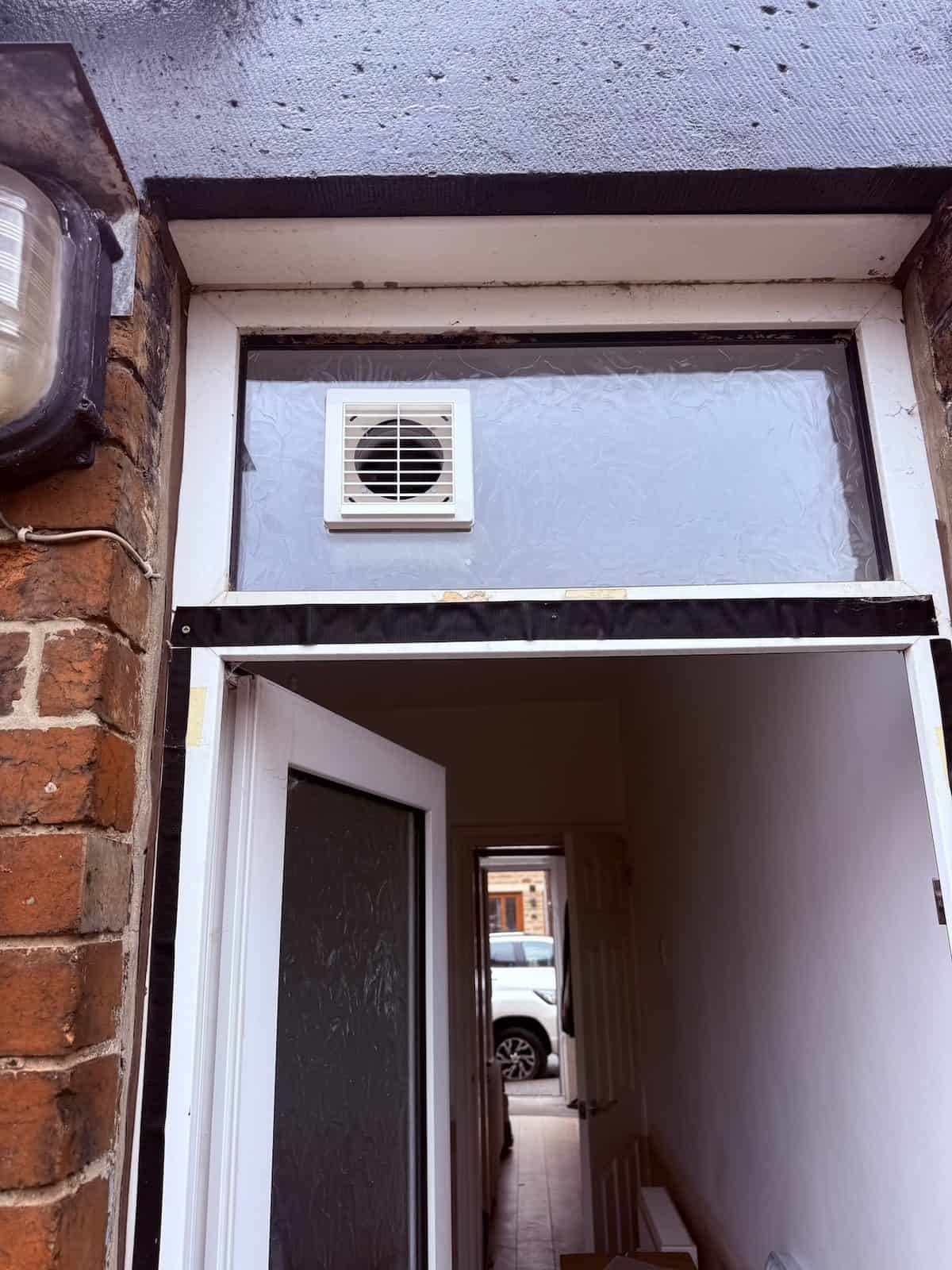 External fixed grille of the window kit in the door light above the back door of a Barnsley property
